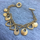 Sweet! Etruscan hammered geometric charm Bracelet 1980s toggle double strand matte gold tone statement dangle modernist Rare!