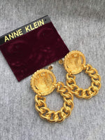 Vintage designer Anne Klein lion hoop earrings on card